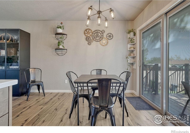 150 Lori Dr, Loveland, CO 80537 - dining room featuring baseboards and wood finished floors