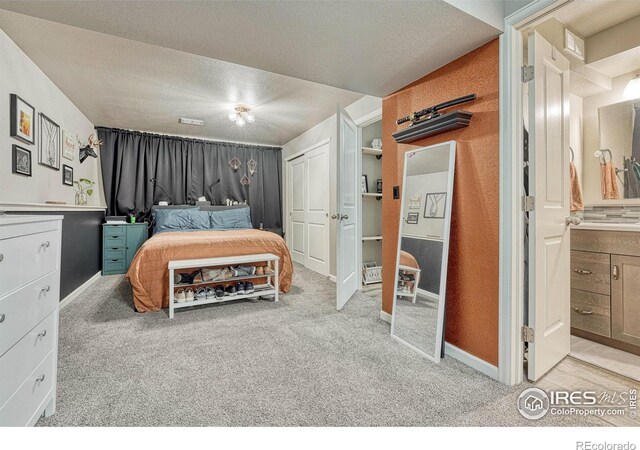150 Lori Dr, Loveland, CO 80537 - bedroom with light colored carpet, a textured ceiling, and baseboards