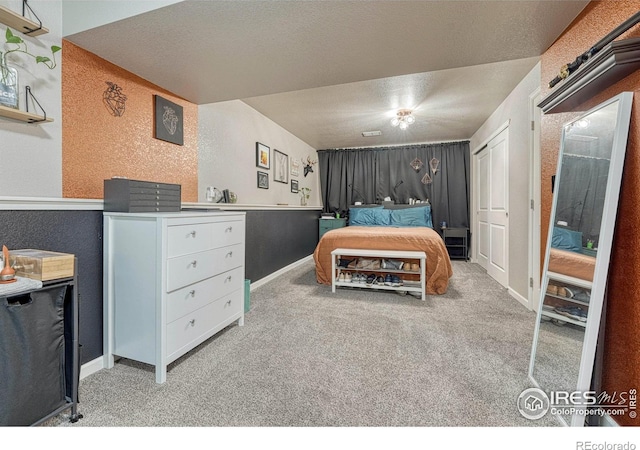 150 Lori Dr, Loveland, CO 80537 - bedroom with carpet floors, a textured ceiling, and baseboards