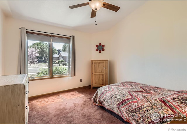 carpeted bedroom featuring baseboards and ceiling fan