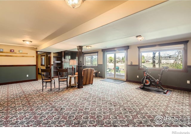 living room with carpet and baseboards