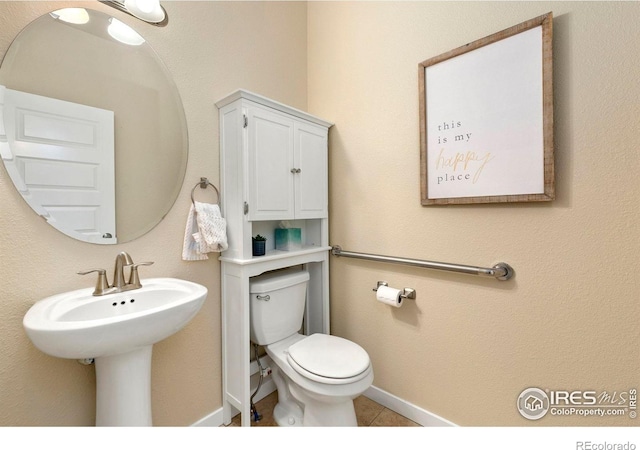 1693 Maseca Plaza Way, Severance, CO 80550 - bathroom featuring toilet, tile patterned floors, and baseboards