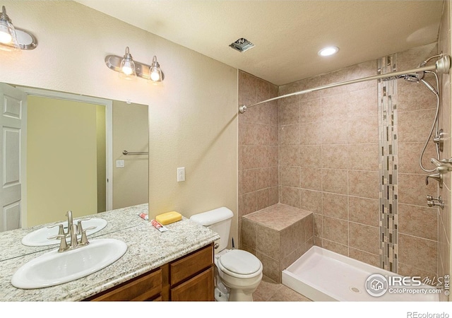 1693 Maseca Plaza Way, Severance, CO 80550 - bathroom featuring toilet, a tile shower, vanity, and recessed lighting