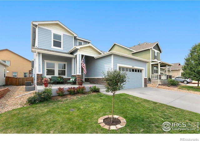 1693 Maseca Plaza Way, Severance, CO 80550 - view of front of home with covered porch, a garage, concrete driveway, and stone siding