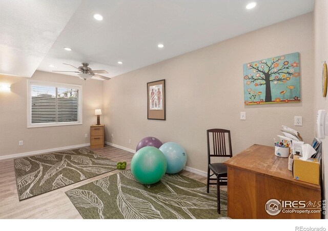 workout area with baseboards, ceiling fan, recessed lighting, and wood finished floors