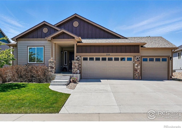 725 Canyonlands St, Berthoud, CO 80513 - craftsman-style home with a shingled roof, an attached garage, stone siding, board and batten siding, and driveway