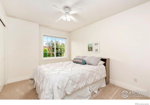 bedroom featuring baseboards, carpet flooring, and ceiling fan