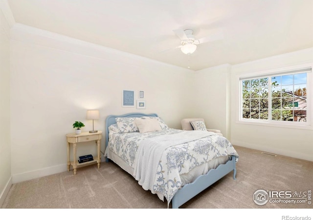 bedroom featuring carpet flooring, a ceiling fan, and baseboards