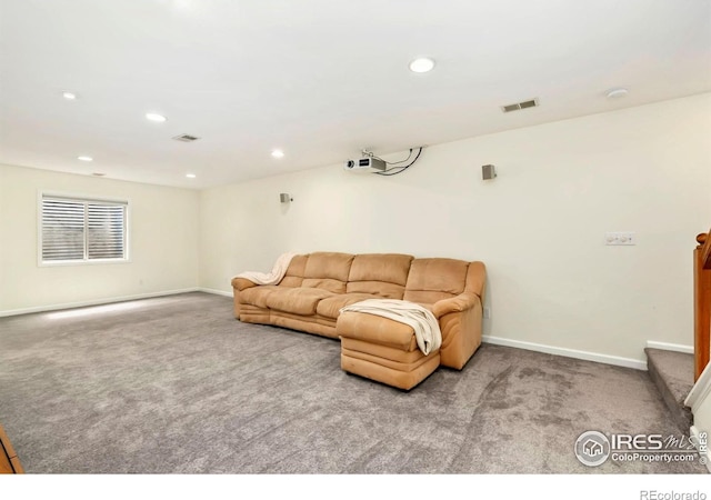 carpeted living area featuring visible vents, recessed lighting, and baseboards