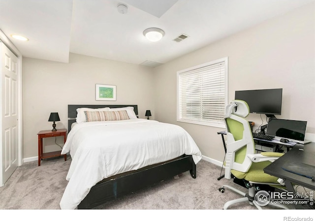 bedroom with carpet floors, baseboards, and visible vents