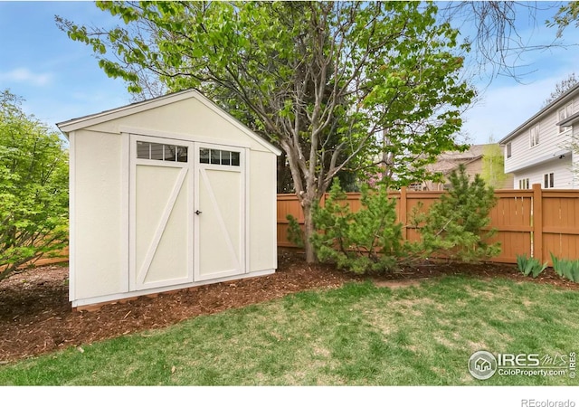 view of shed with fence