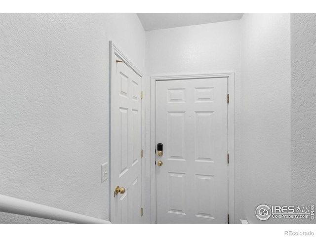 entryway with a textured wall