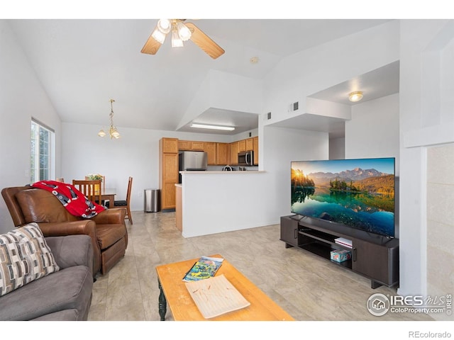 living room with visible vents, a ceiling fan, and lofted ceiling