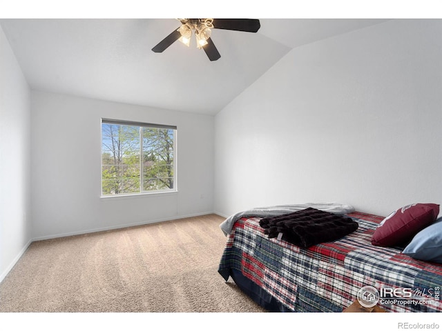 bedroom with carpet floors, baseboards, ceiling fan, and vaulted ceiling