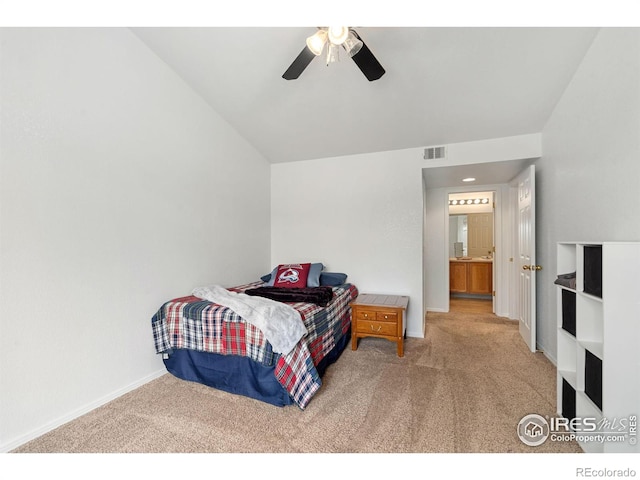 bedroom with visible vents, light carpet, baseboards, ceiling fan, and vaulted ceiling