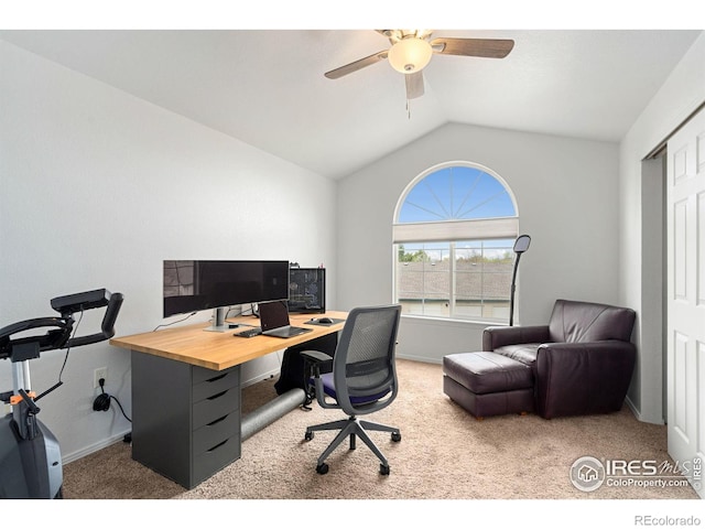 carpeted office featuring ceiling fan, vaulted ceiling, and baseboards