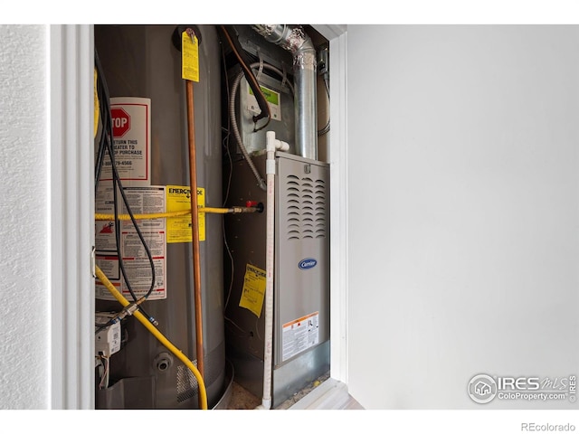 utility room with water heater