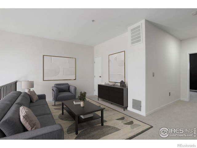 living room with baseboards, light carpet, and visible vents
