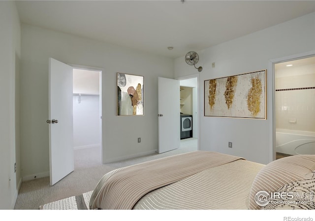 1200 Yarmouth Ave Unit 238, Boulder, CO 80304 - bedroom featuring light carpet, a walk in closet, washer / clothes dryer, baseboards, and a closet