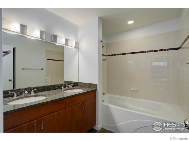 bathroom with a sink, recessed lighting, shower / tub combination, and double vanity