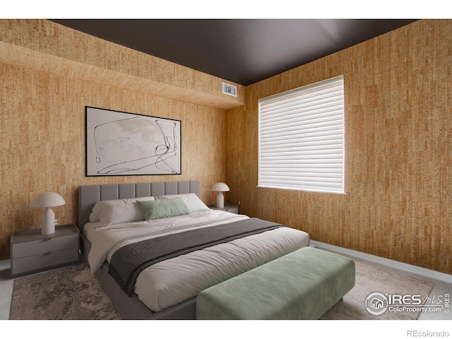 carpeted bedroom with baseboards, wallpapered walls, and visible vents