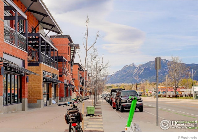 1200 Yarmouth Ave Unit 238, Boulder, CO 80304 - view of road featuring sidewalks, a mountain view, street lighting, and curbs
