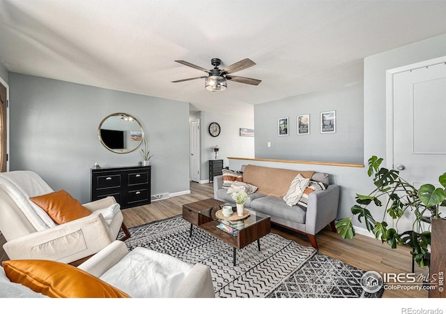 7960 Estes Ct, Arvada, CO 80005 - living area featuring baseboards, a ceiling fan, wood finished floors, and visible vents