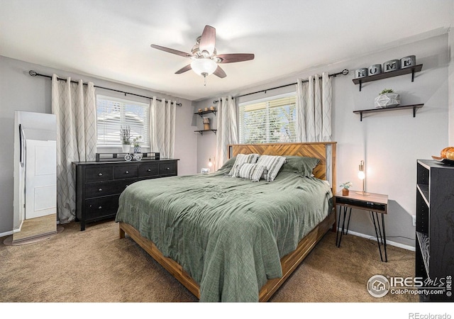 7960 Estes Ct, Arvada, CO 80005 - carpeted bedroom with baseboards, a ceiling fan, and multiple windows