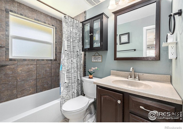 7960 Estes Ct, Arvada, CO 80005 - bathroom featuring vanity, shower / bath combination with curtain, toilet, and visible vents