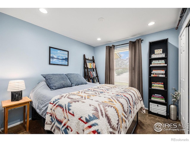 bedroom featuring dark colored carpet, recessed lighting, and baseboards