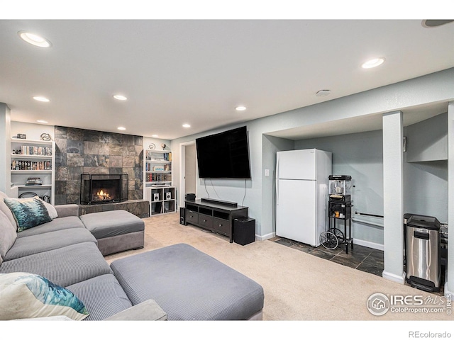 carpeted living area featuring recessed lighting, baseboards, and a tile fireplace
