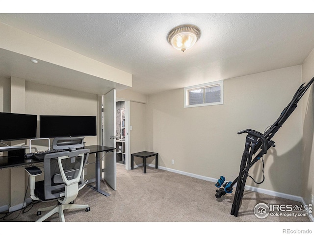 carpeted home office with baseboards