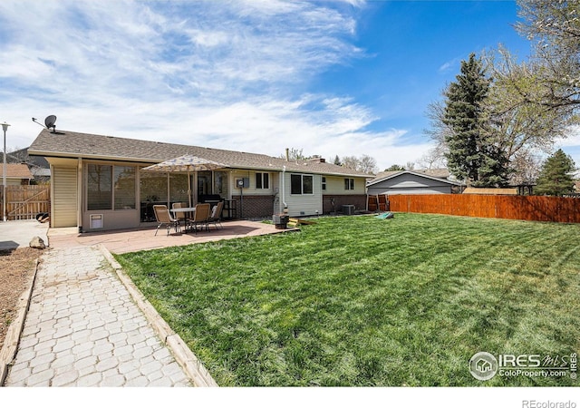 7960 Estes Ct, Arvada, CO 80005 - rear view of house featuring a patio, a fenced backyard, central air condition unit, and a yard