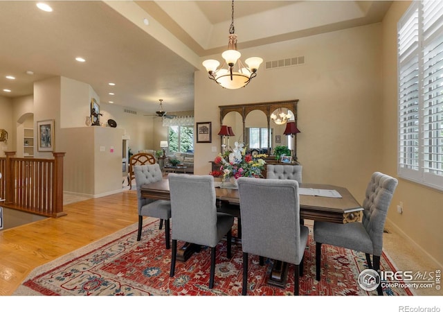 6836 Spanish Bay Dr, Windsor, CO 80550 - dining area with ceiling fan with notable chandelier, recessed lighting, wood finished floors, and visible vents