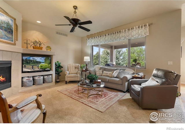 6836 Spanish Bay Dr, Windsor, CO 80550 - carpeted living area featuring a ceiling fan, visible vents, recessed lighting, and a fireplace