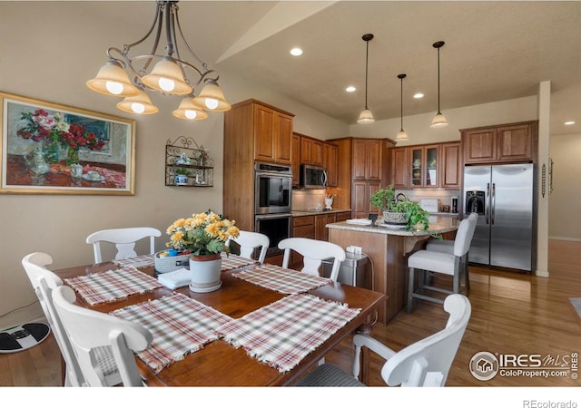 6836 Spanish Bay Dr, Windsor, CO 80550 - dining space featuring recessed lighting, baseboards, and wood finished floors