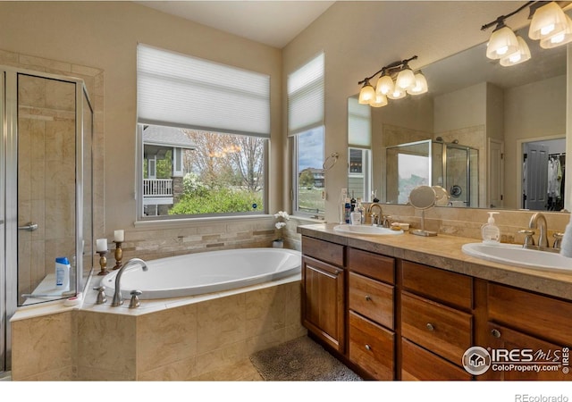6836 Spanish Bay Dr, Windsor, CO 80550 - full bath featuring double vanity, a sink, a bath, and a stall shower