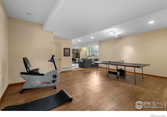 6836 Spanish Bay Dr, Windsor, CO 80550 - recreation room featuring baseboards, recessed lighting, and wood finished floors