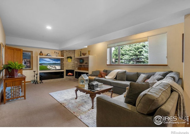 6836 Spanish Bay Dr, Windsor, CO 80550 - living area featuring a large fireplace, baseboards, carpet, and recessed lighting