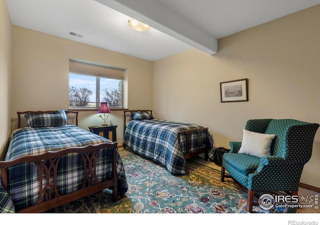 6836 Spanish Bay Dr, Windsor, CO 80550 - carpeted bedroom with visible vents and beamed ceiling