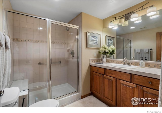 6836 Spanish Bay Dr, Windsor, CO 80550 - full bath with visible vents, vanity, toilet, and a shower stall