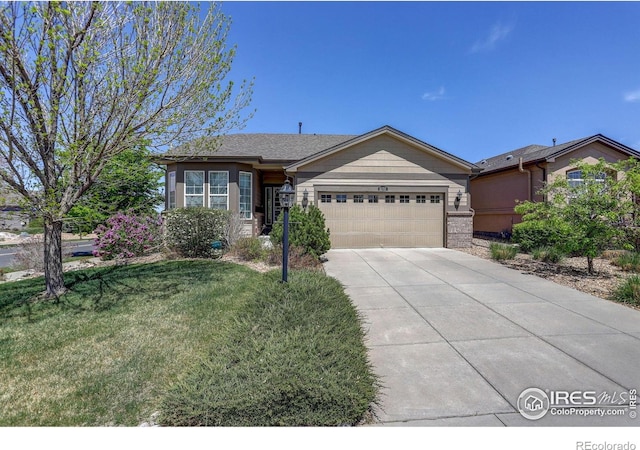 ranch-style house with a garage, a front lawn, and driveway