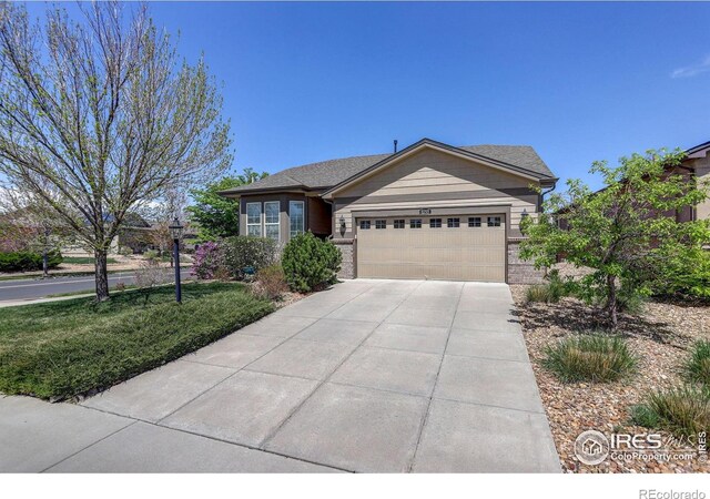 single story home featuring an attached garage and driveway