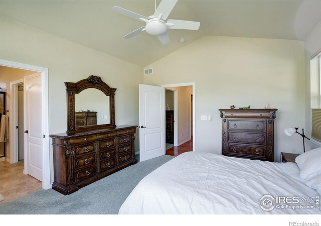 bedroom featuring visible vents, a ceiling fan, and vaulted ceiling