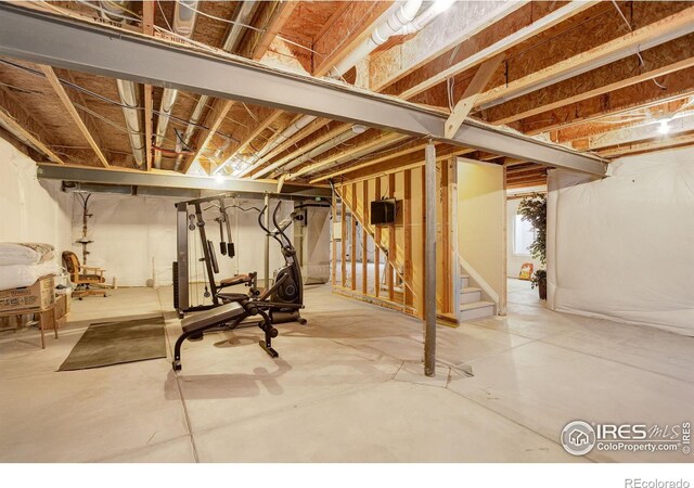 unfinished below grade area featuring stairway