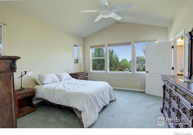 carpeted bedroom with baseboards, ceiling fan, and vaulted ceiling