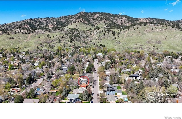 560 Iris Ave, Boulder, CO 80304 - aerial overview of property's location with mountains and nearby suburban area