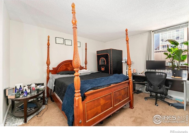 carpeted bedroom featuring a textured ceiling
