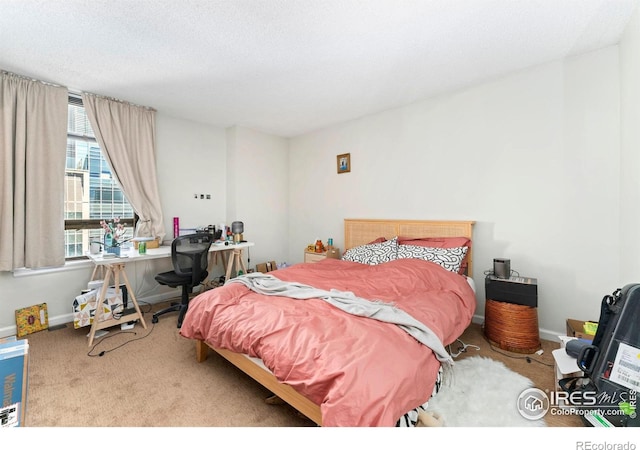 carpeted bedroom featuring baseboards