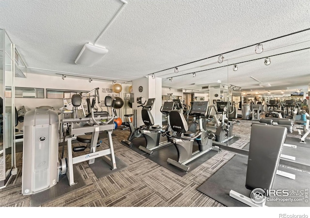 workout area with a textured ceiling